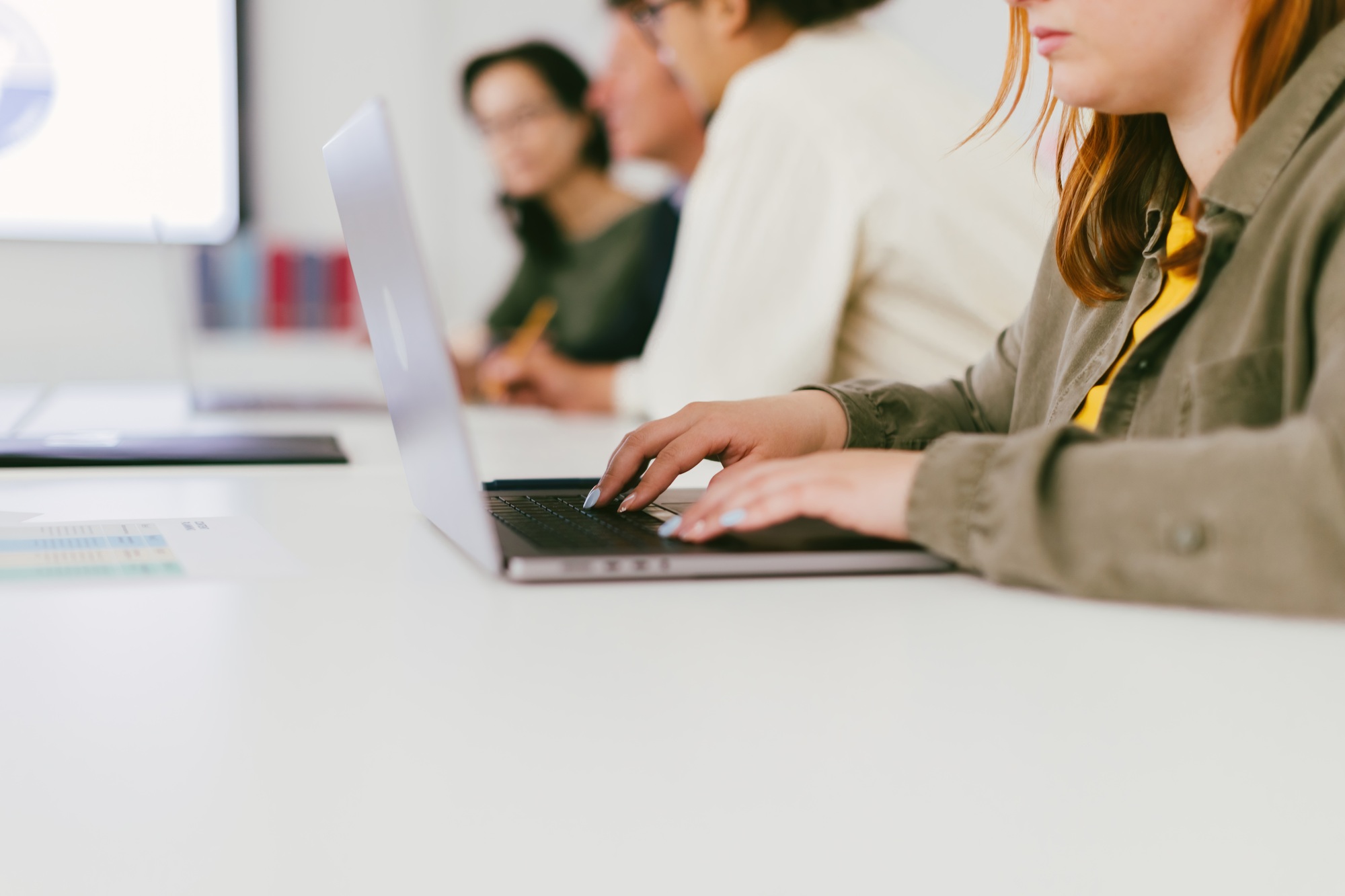 Email Marketing for Small Businesses: How to Get Started on a Budget Detail of the hand of a young office worker typing an email on the laptop